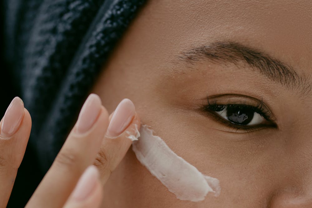 woman applying eye cream