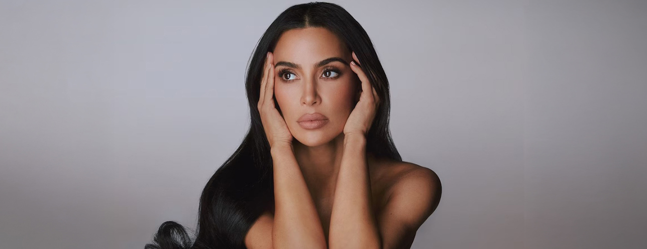 kim kardashian posing for SKKN BY KIM MAKEUP